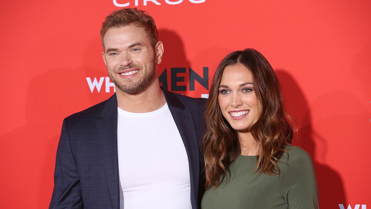 Kellan and Brittany Lutz smiling on the red carpet