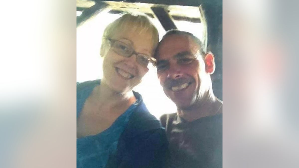 Kelly McWhirter is pictured with her estranged husband and suspect in her death Steven Higgins