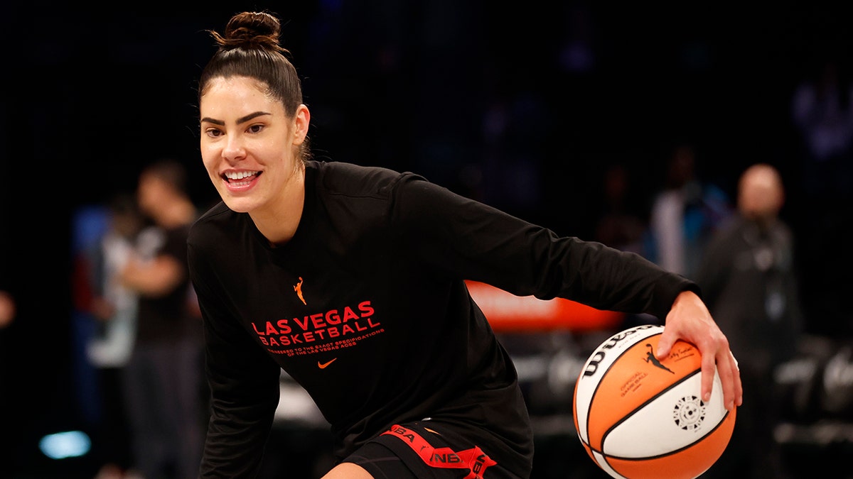 Kelsey Plum dribbles basketball