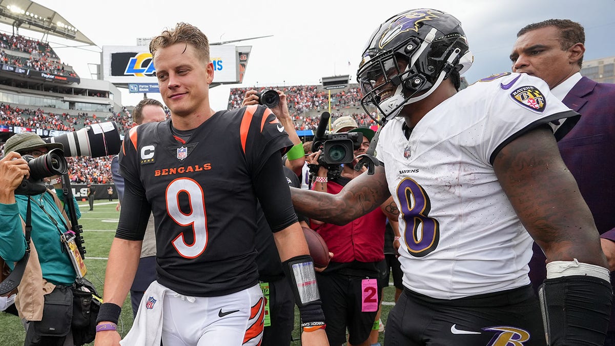 Joe Burrow and Lamar Jackson greet each other after a game