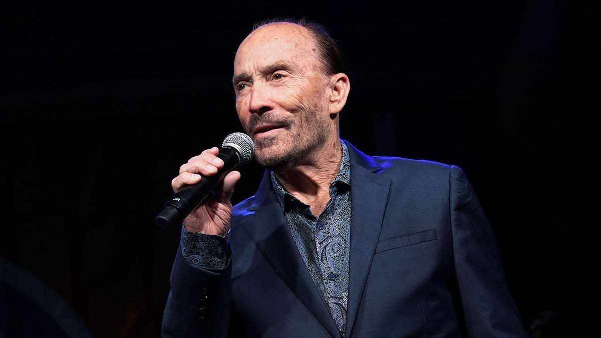 Singer Lee Greenwood with microphone