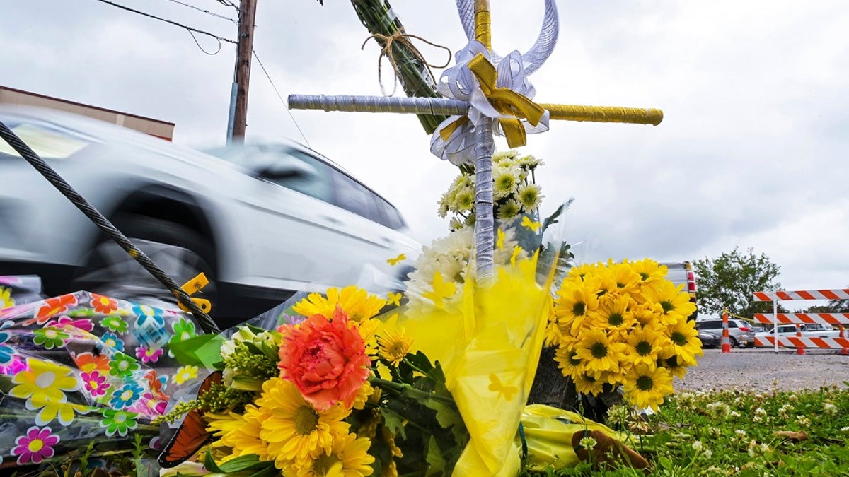 Flowers in honor of Linda Frickey, who was killed during a carjacking