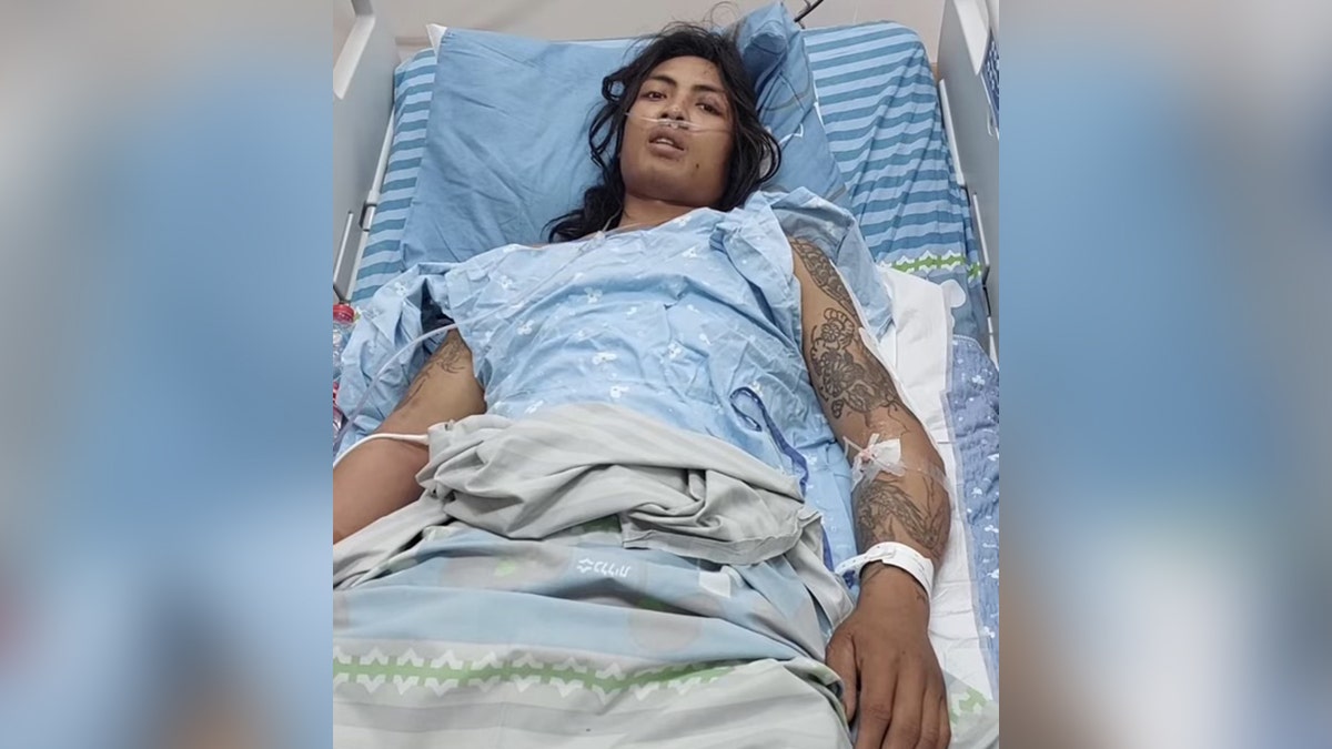 Mitchai Sarabon in a hospital bed