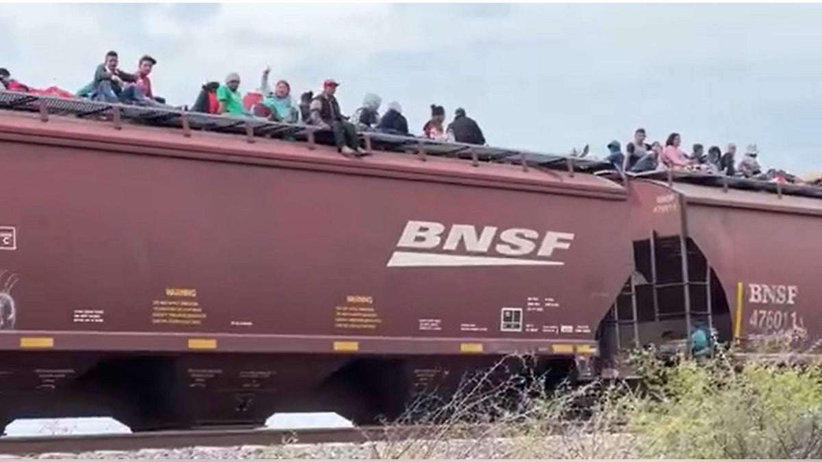 Video shows train in Mexico filled with migrants riding on top as it heads to US southern border - Fox News