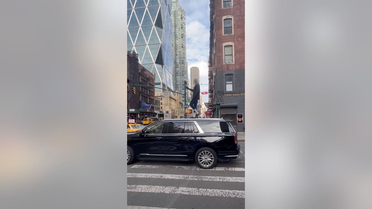 NYC carjacking suspect on SUV