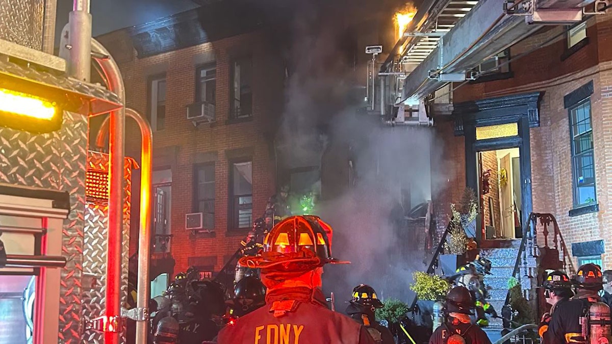 Flames shoot out of Brooklyn residential building