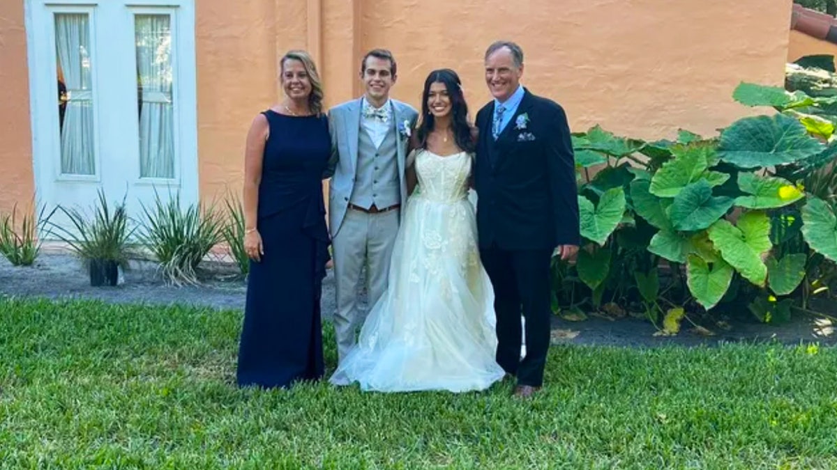 Wedding photo with groom's parents.