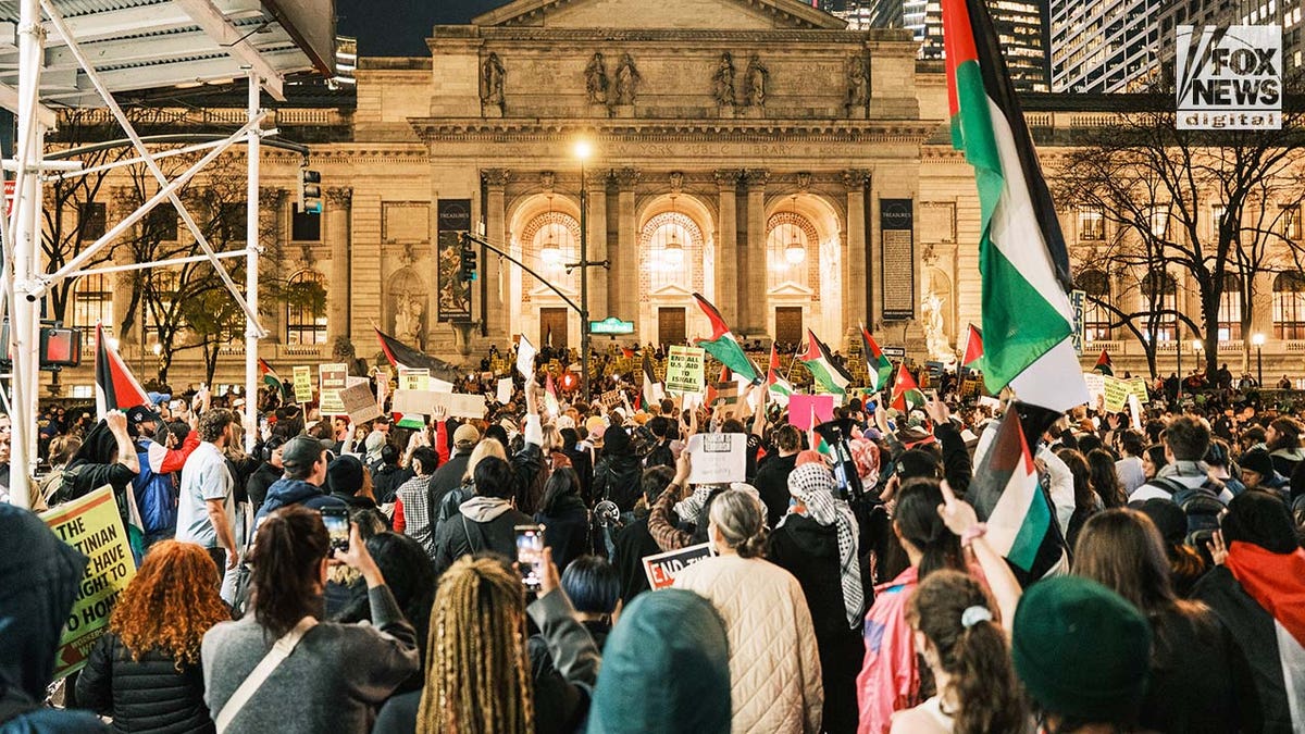 Pro-Palestinian protesters gather outside the New York Public Library in midtown Manhattan.