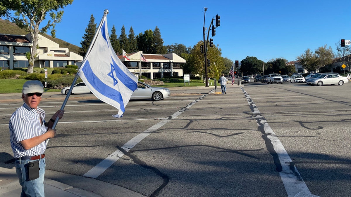 Paul Kessler holding Israel flag