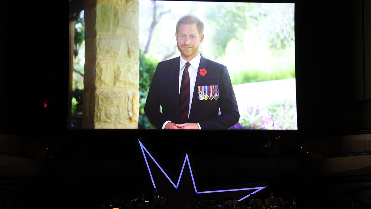 Picture of Prince Harry on monitor at event