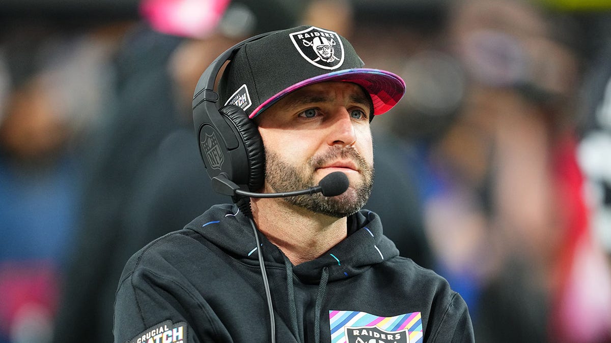 Mick Lombardi looks on before a Las Vegas Raiders game
