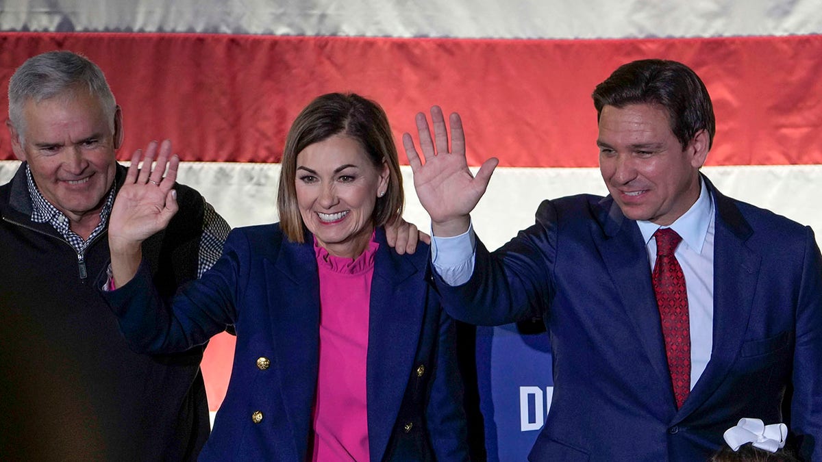 Kim Reynolds and Ron DeSantis