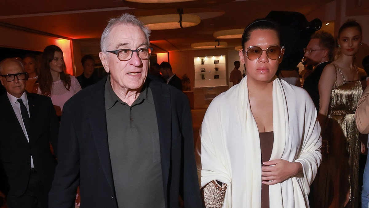 Robert De Niro and Tiffany Chen at a party