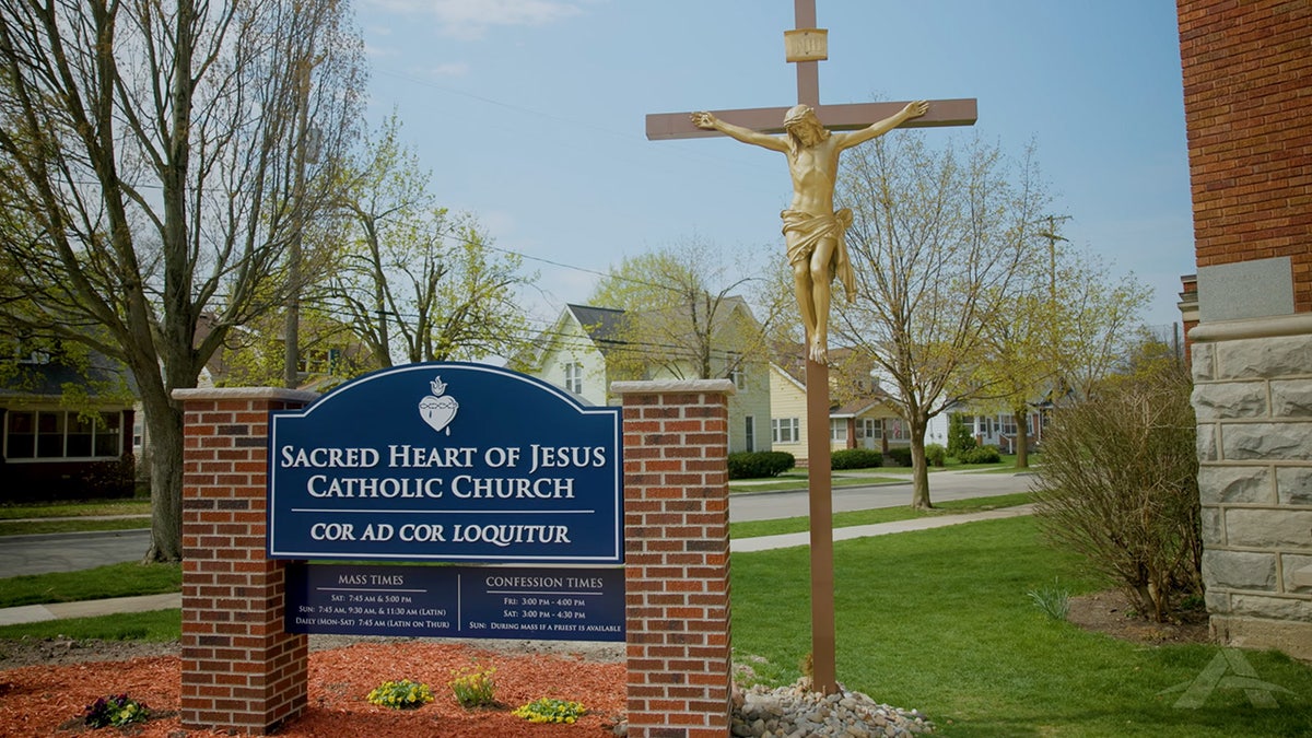 Sacred Heart Parish Michigan sign and crucifix
