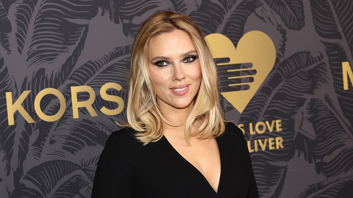 Scarlett Johansson smiling on a red carpet