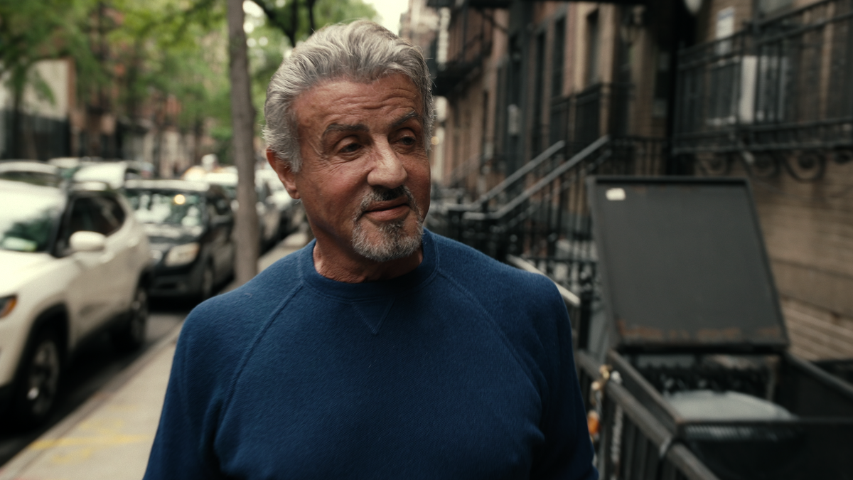 Scene of Sylvester Stallone walking on the street in "Sly"
