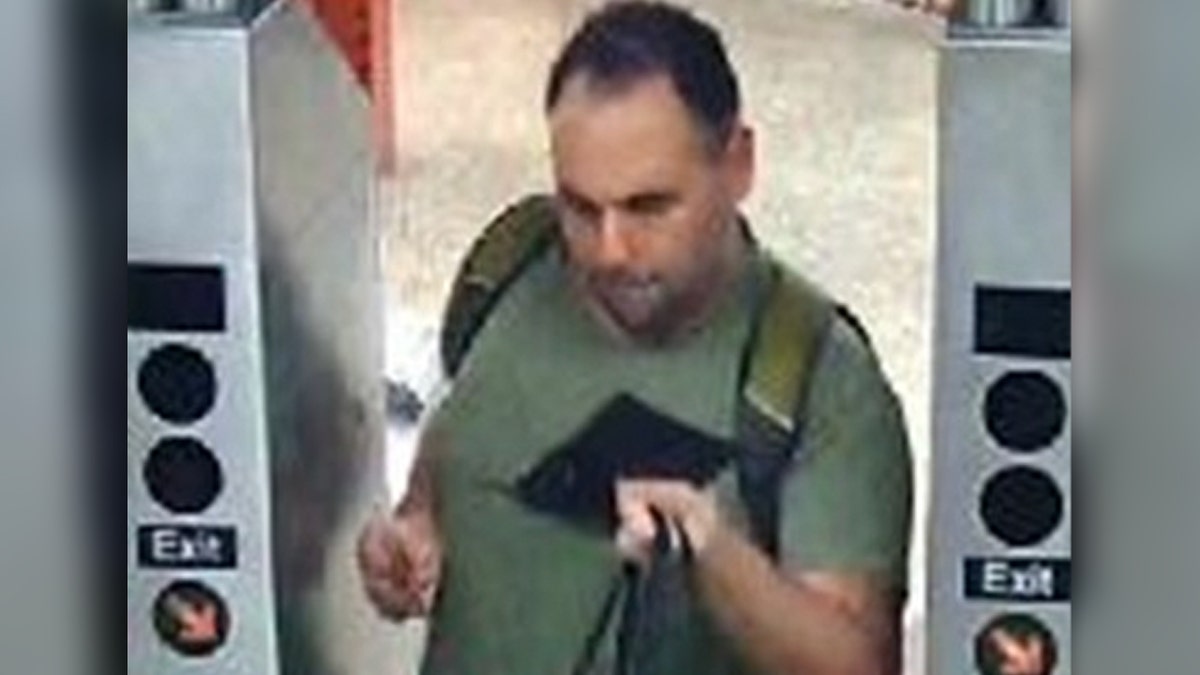 Subway vigilante suspect leaves through turnstile