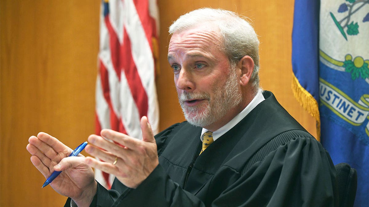 Judge addressing courtroom