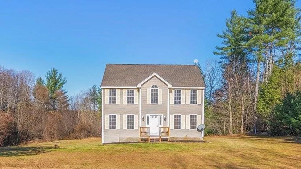 A two-story home in a rural area of New Hampshire.