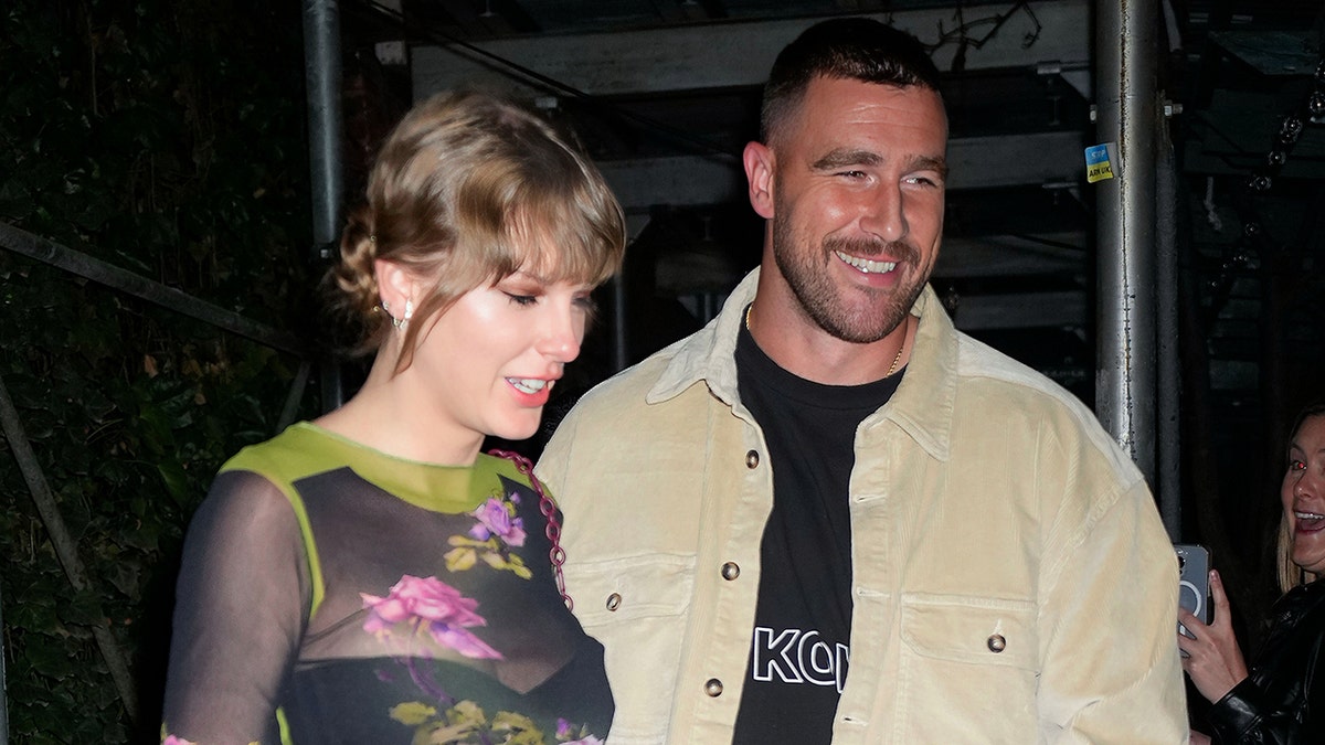 Taylor Swift and Travis kelce smile as they leave the Waverly Inn in New York City
