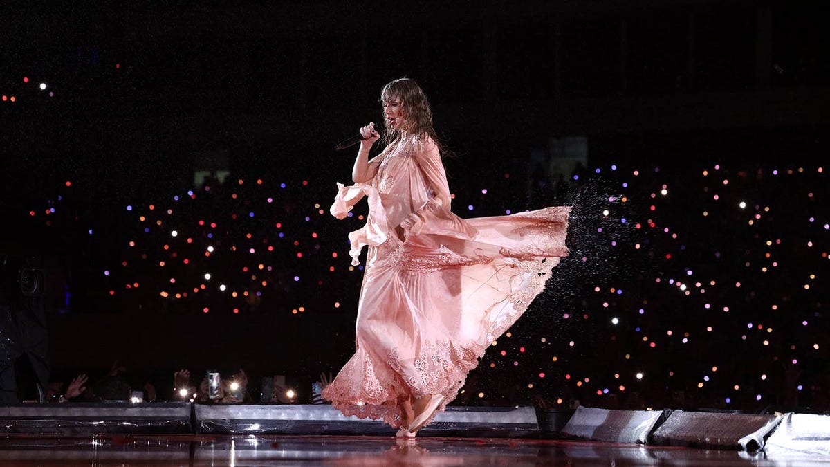 Taylor Swift performing in the rain