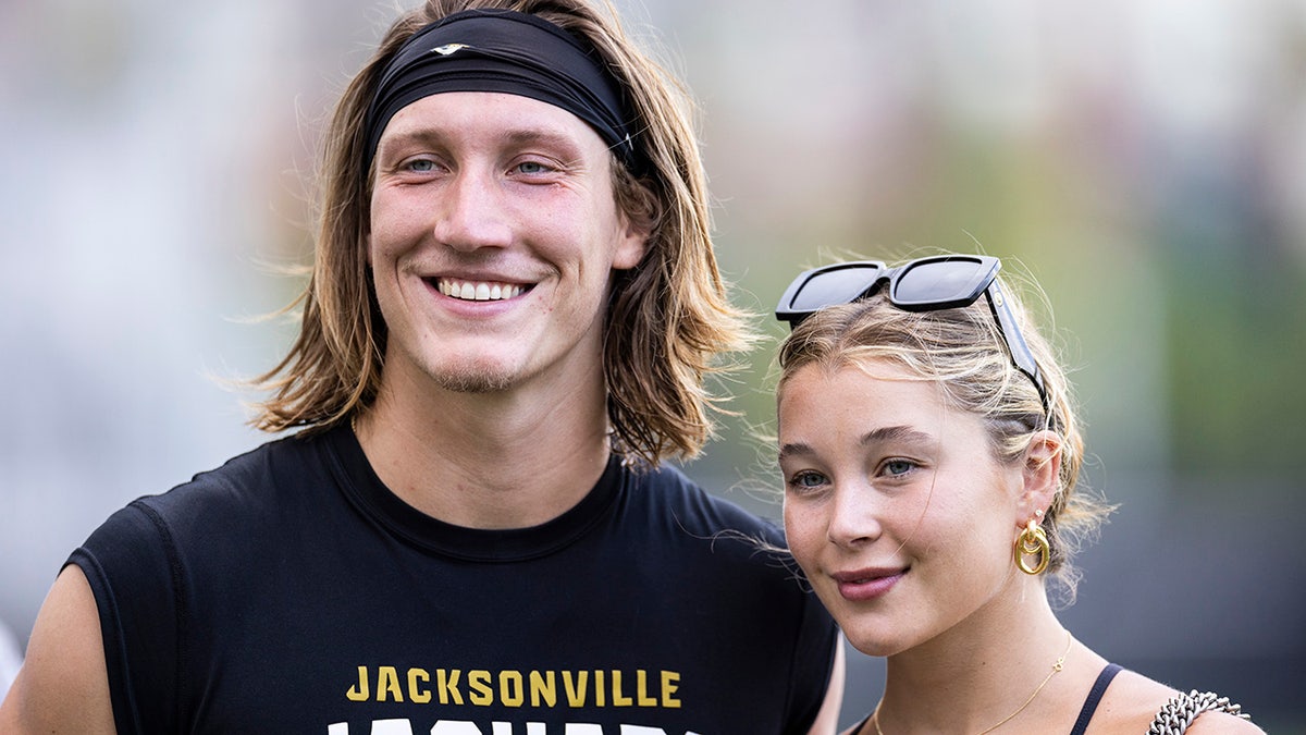 Trevor Lawrence takes a photo with Marissa
