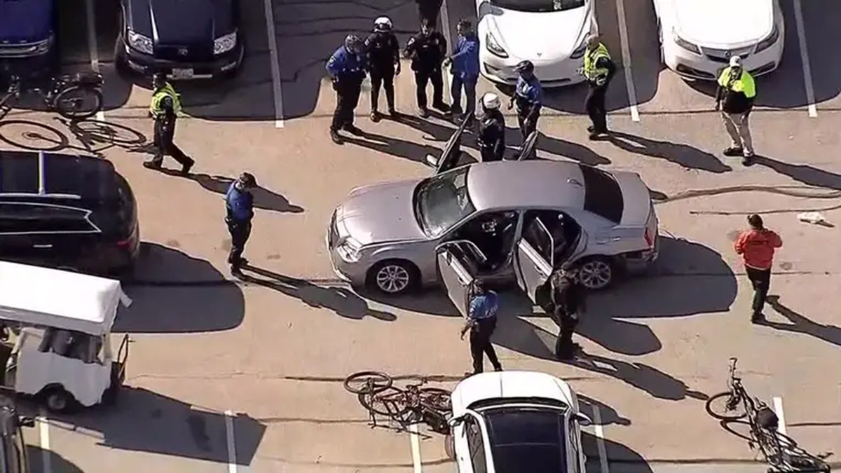 Man arrested after firing shots in parking lot near World Series Parade