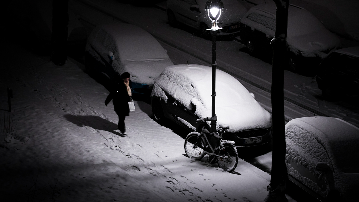 Woman walking alone at night
