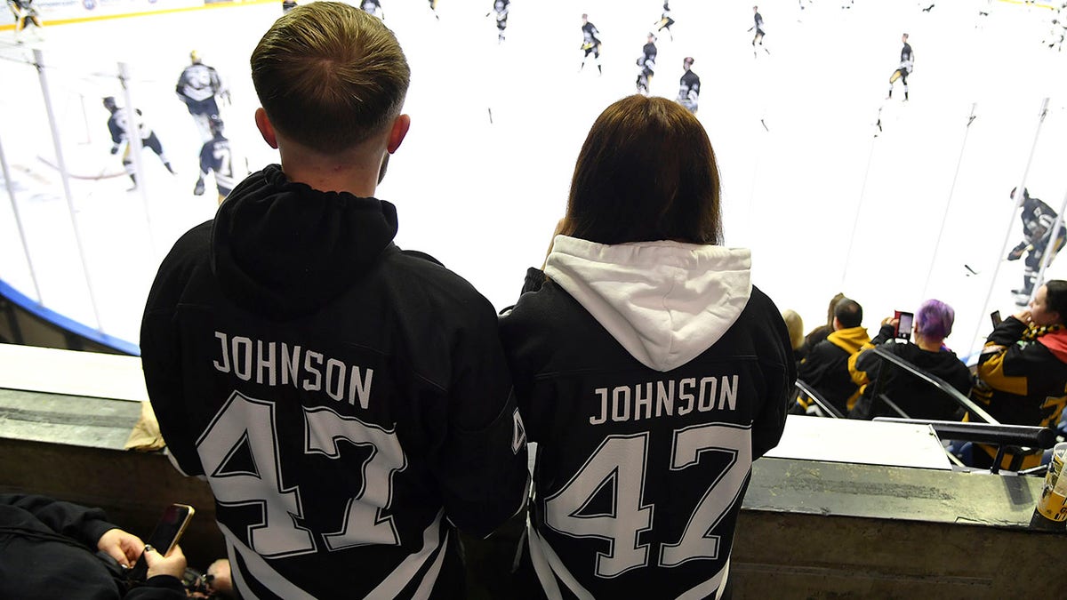 Fans in Adam Johnson jerseys