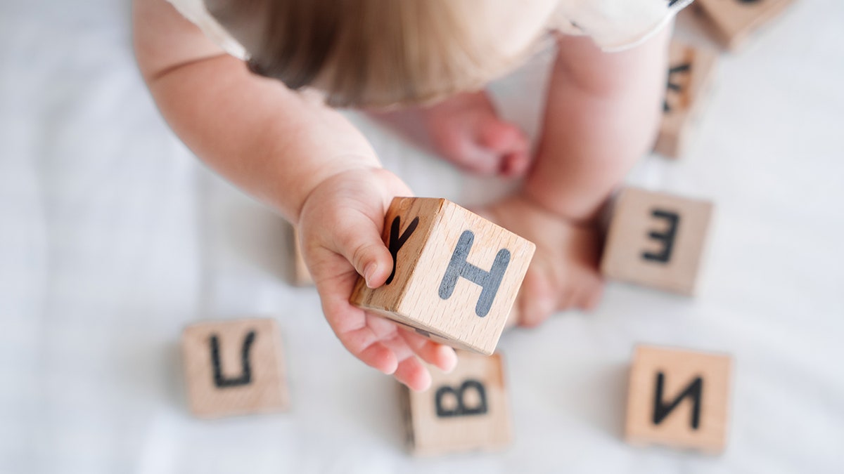 baby playing with blocks