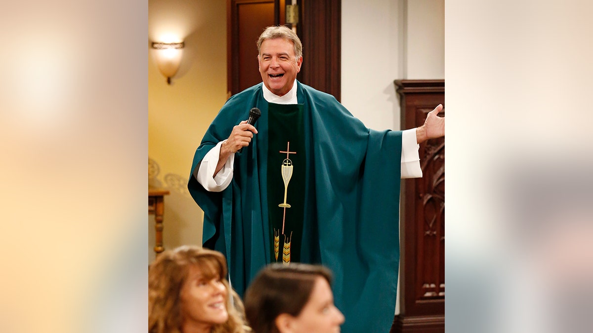 Bill Engvall in a teal vestment as Reverend Paul on "Last Man Standing"