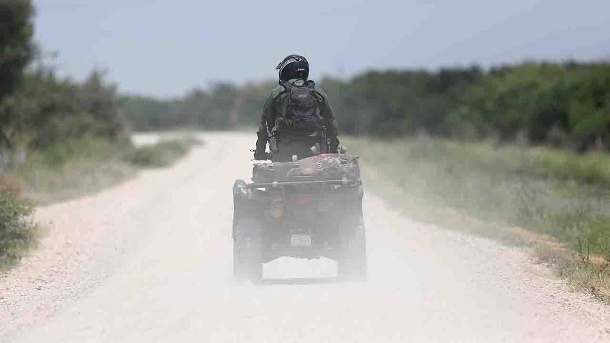 U.S. Border Patrol agent patrols on an ATV