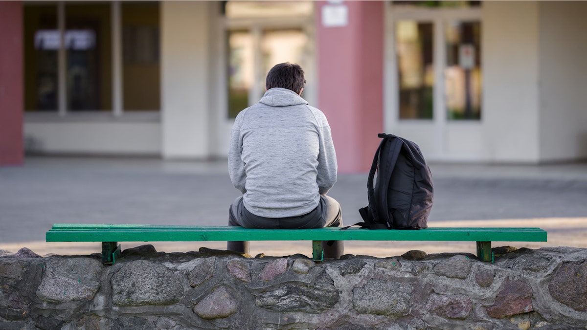 Depression rates higher among college students than their peers, study suggests 4 Boy on bench