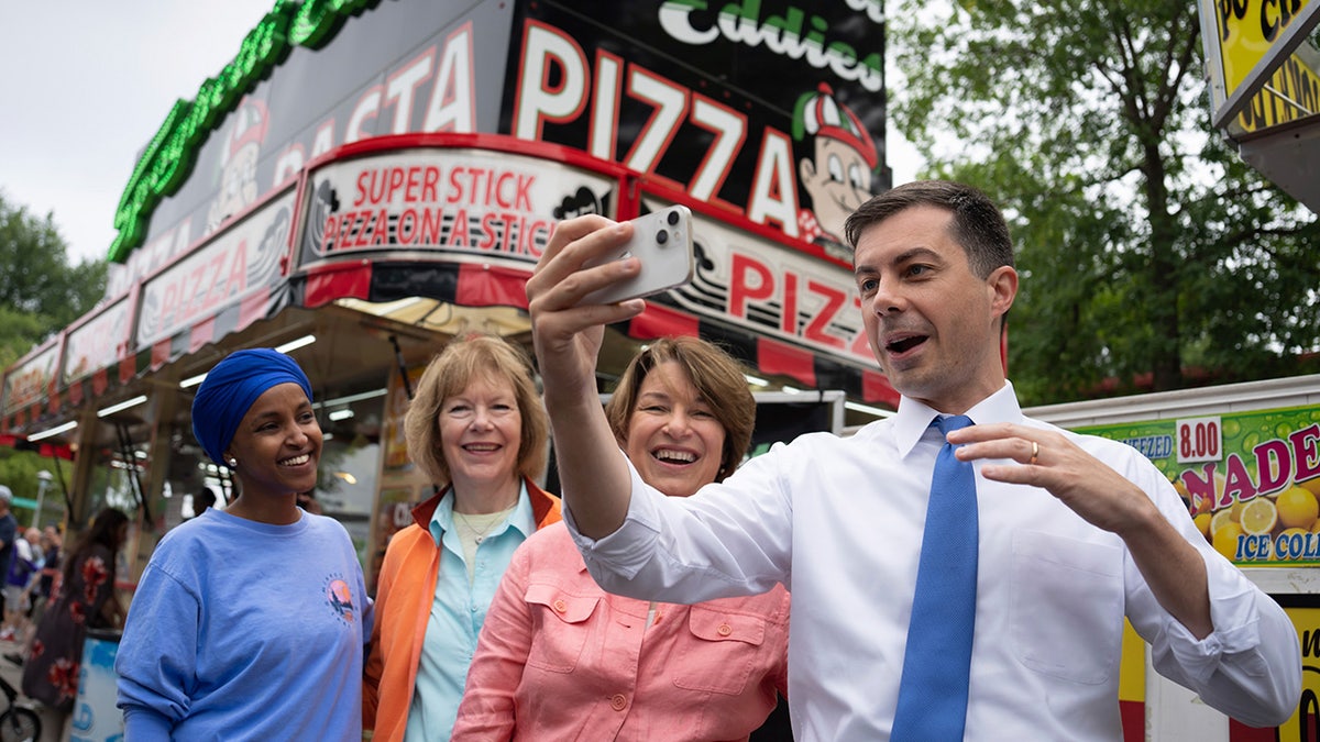 Transportation Secretary Pete Buttigieg did a live video chat as he toured the Minnesota State Fair with Rep. Ilhan Omar, Sen. Tina Smith, and Sen. Amy Klobuchar Thursday, Aug. 25, 2022, Falcon Heights, Minn. U.S. Transportation Secretary Pete Buttigieg, on a four-day tour of six states to highlight infrastructure projects funded with federal dollars in the Biden administration's infrastructure act. (Photo by Glen Stubbe/Star Tribune via Getty Images)