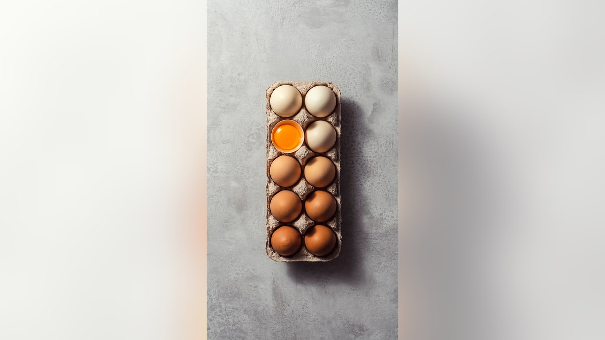 Box of eggs on grey background