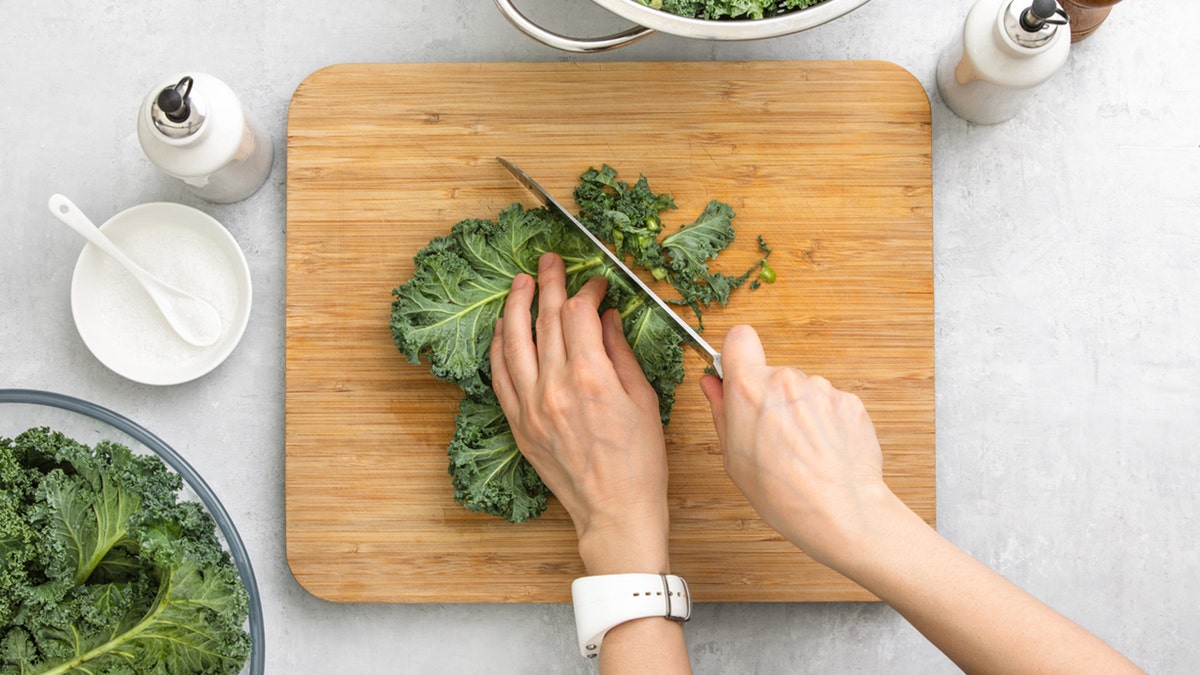 chopping kale on cutting board
