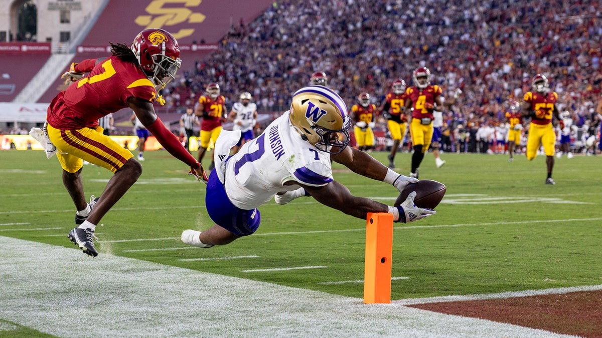 Dillon Johnson diving for end zone