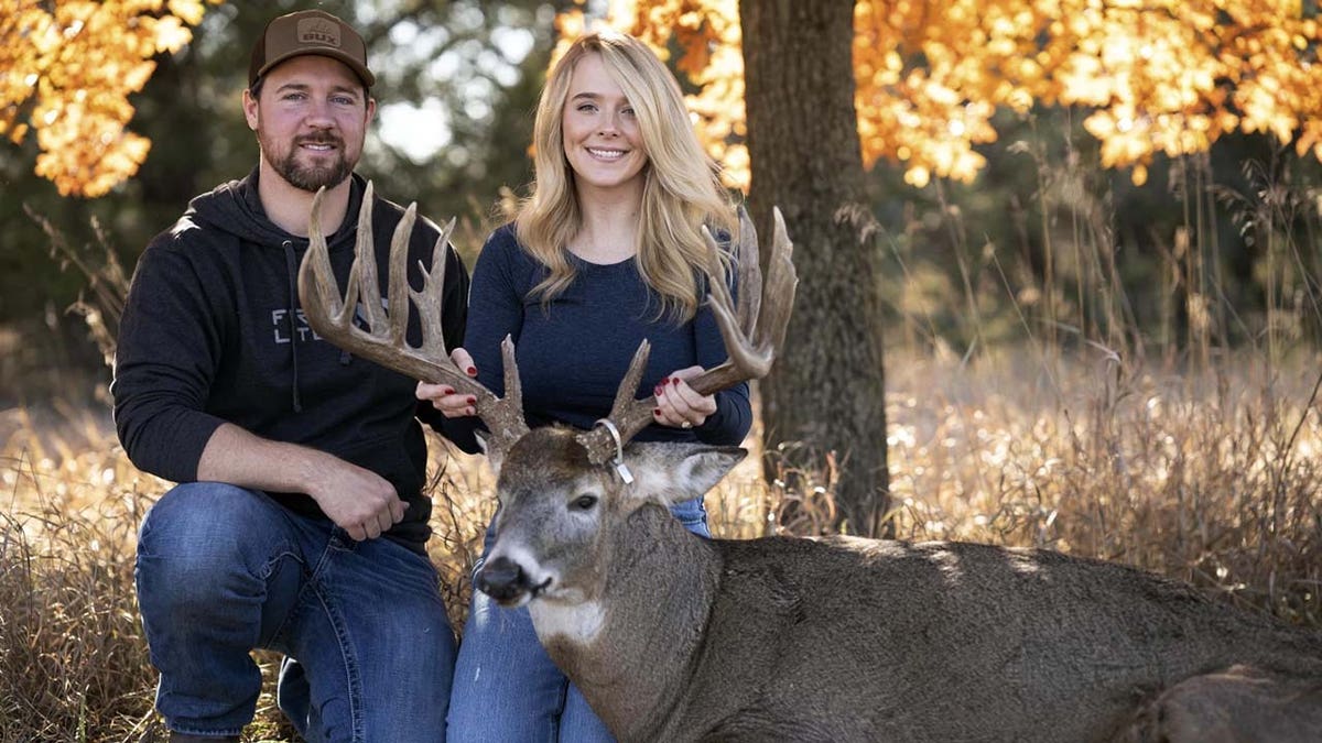 Cole Bures and Samantha Camenzind with prize buck