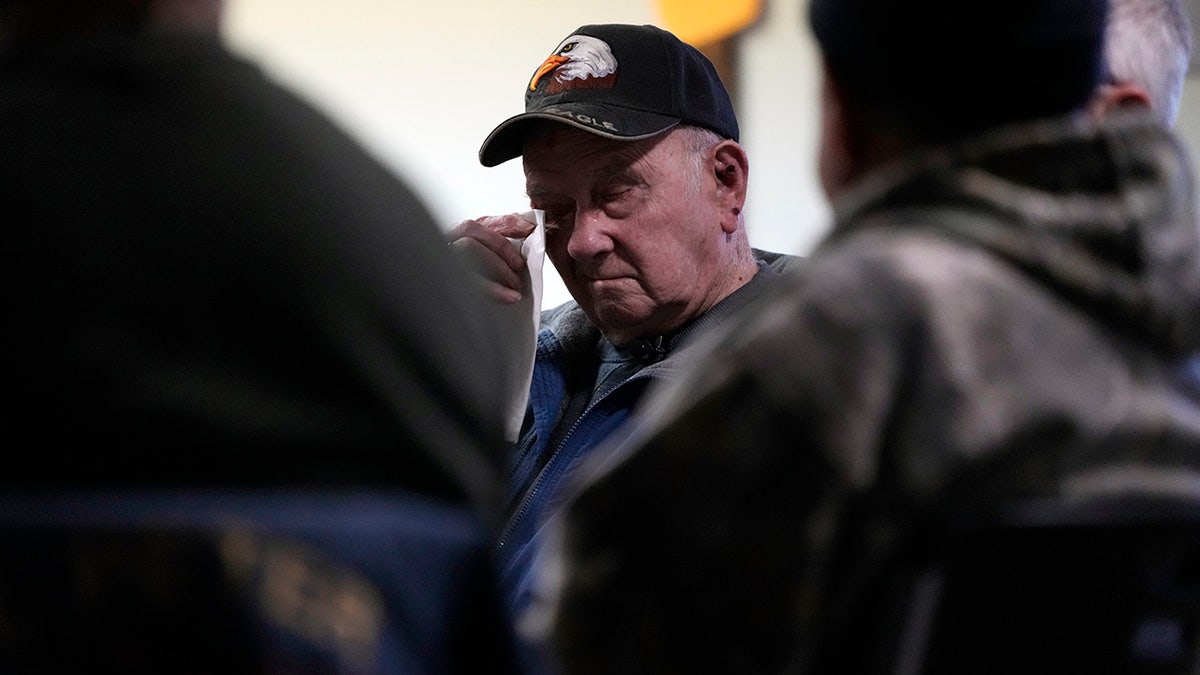 Earl Meyer wiping away a tear