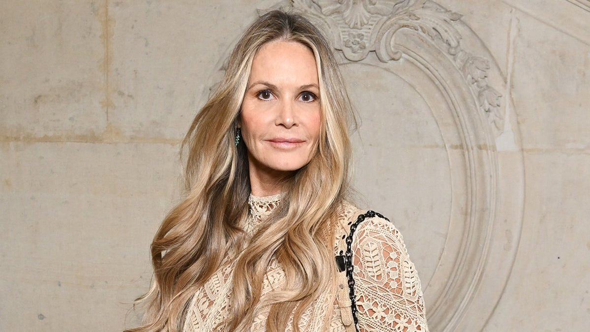 Elle Macpherson wears nude dress to fashion show