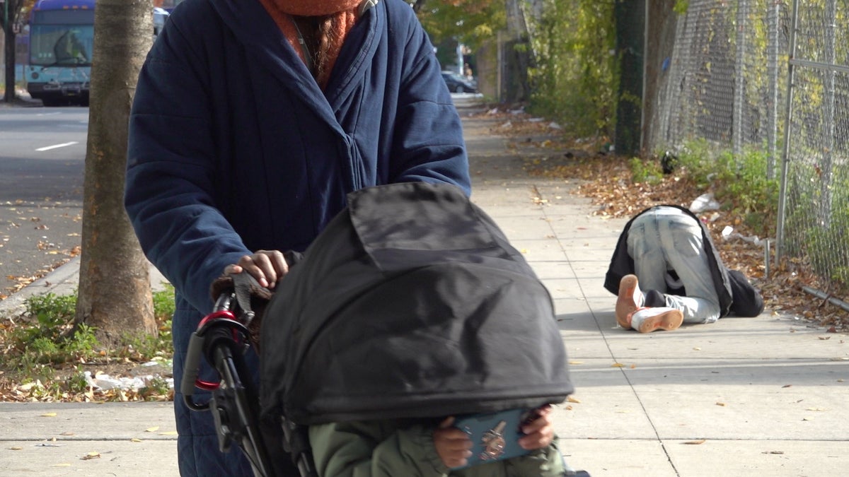 francesca barreiro walking past drug user with daughter