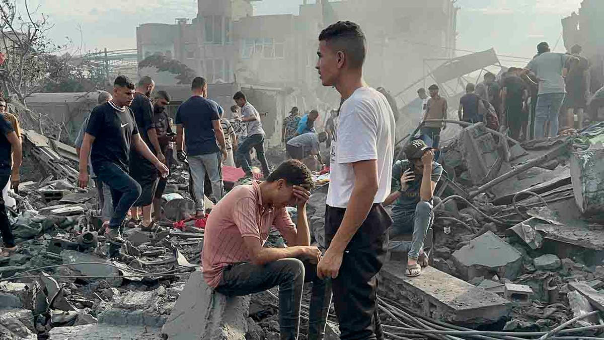 Palestinians amid rubble