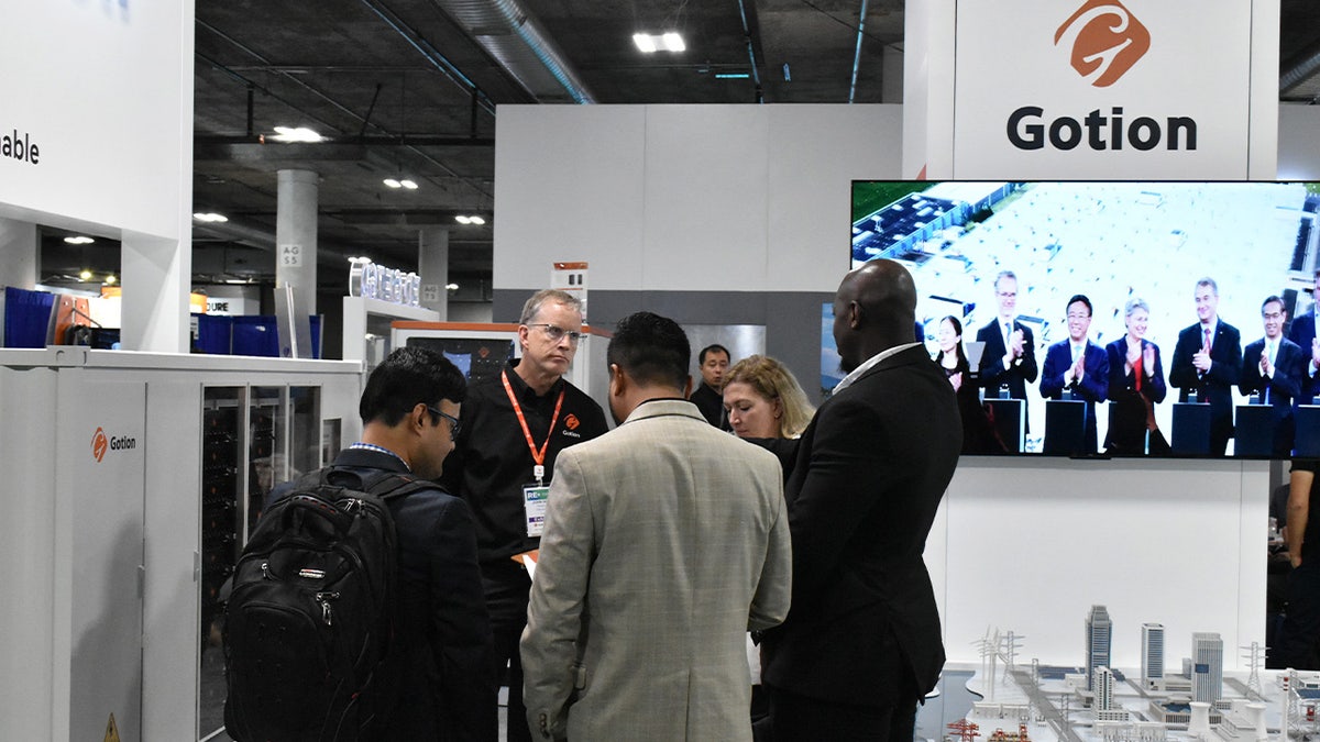 People visit the exhibition area of Chinese company Gotion during the RE+ 2023 exhibition in Las Vegas, the United States, on Sept. 12, 2023. Chinese companies took the spotlight at North America's leading clean energy expo held in Las Vegas this week, expanding their influence and opportunities on the global market. (Photo by Gao Shan/Xinhua via Getty Images)