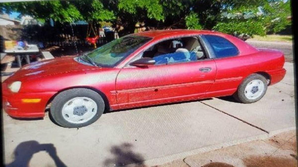 Images of a red 1995 Plymouth Neon