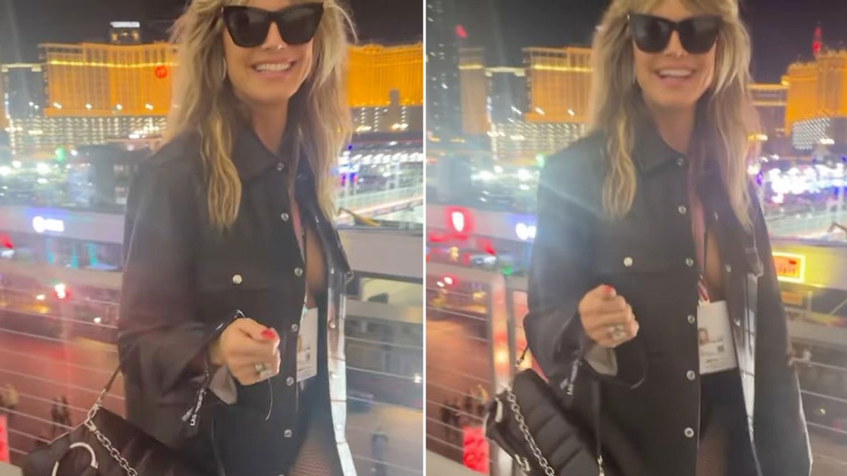 Heidi Klum laughs while walking over a bridge in Las Vegas
