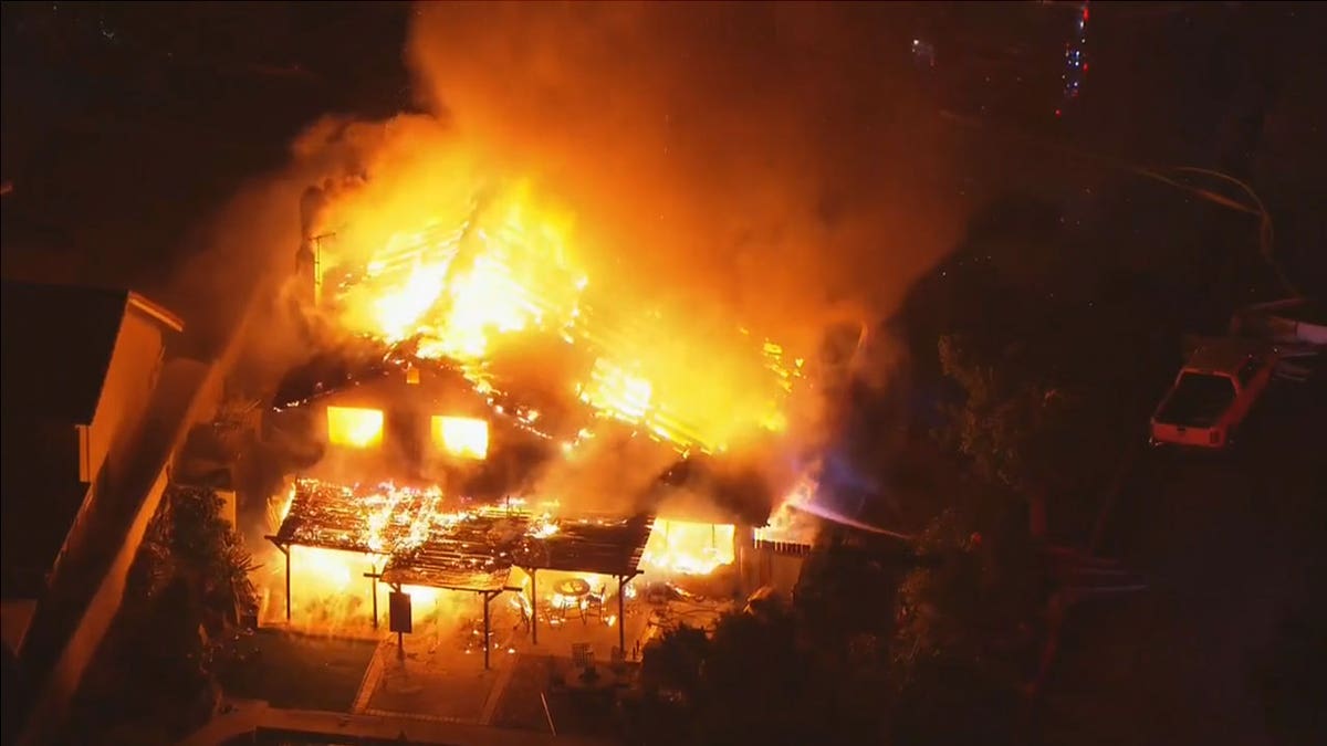 an aerial shot of a house on fire in Upland California