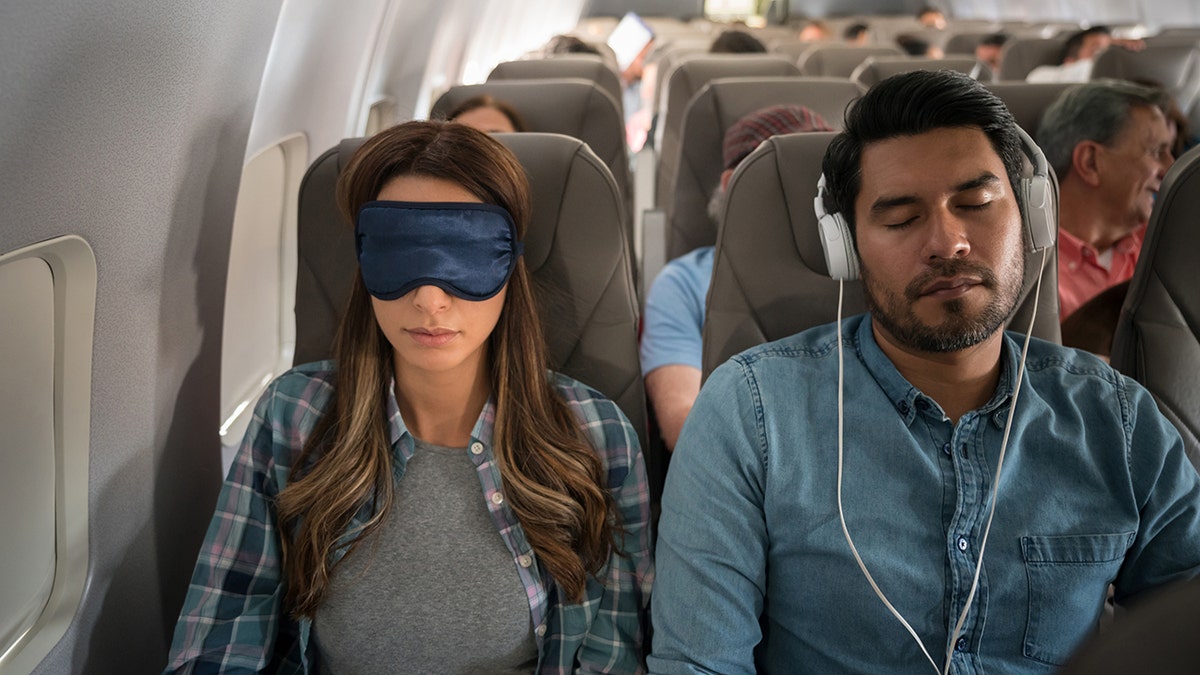 people sleeping on a plane