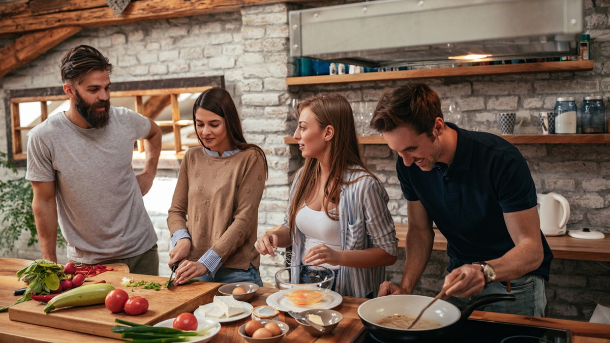 cooking in kitchen with friends