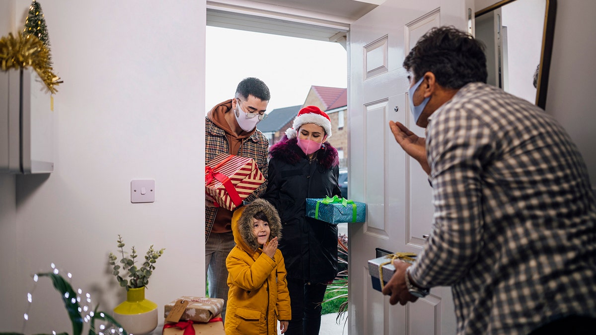 family wearing masks at christmas