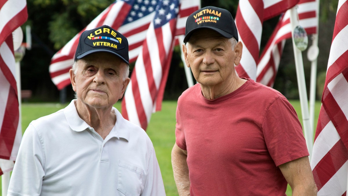 two male veterans posing together